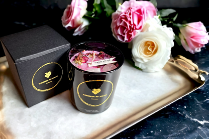 Hand made, hot pink scented soy 30cl candle, in a black gloss glass container, with pink dried flowers, and crystals embedded into it. Comes in a luxury gift box and ribbon
